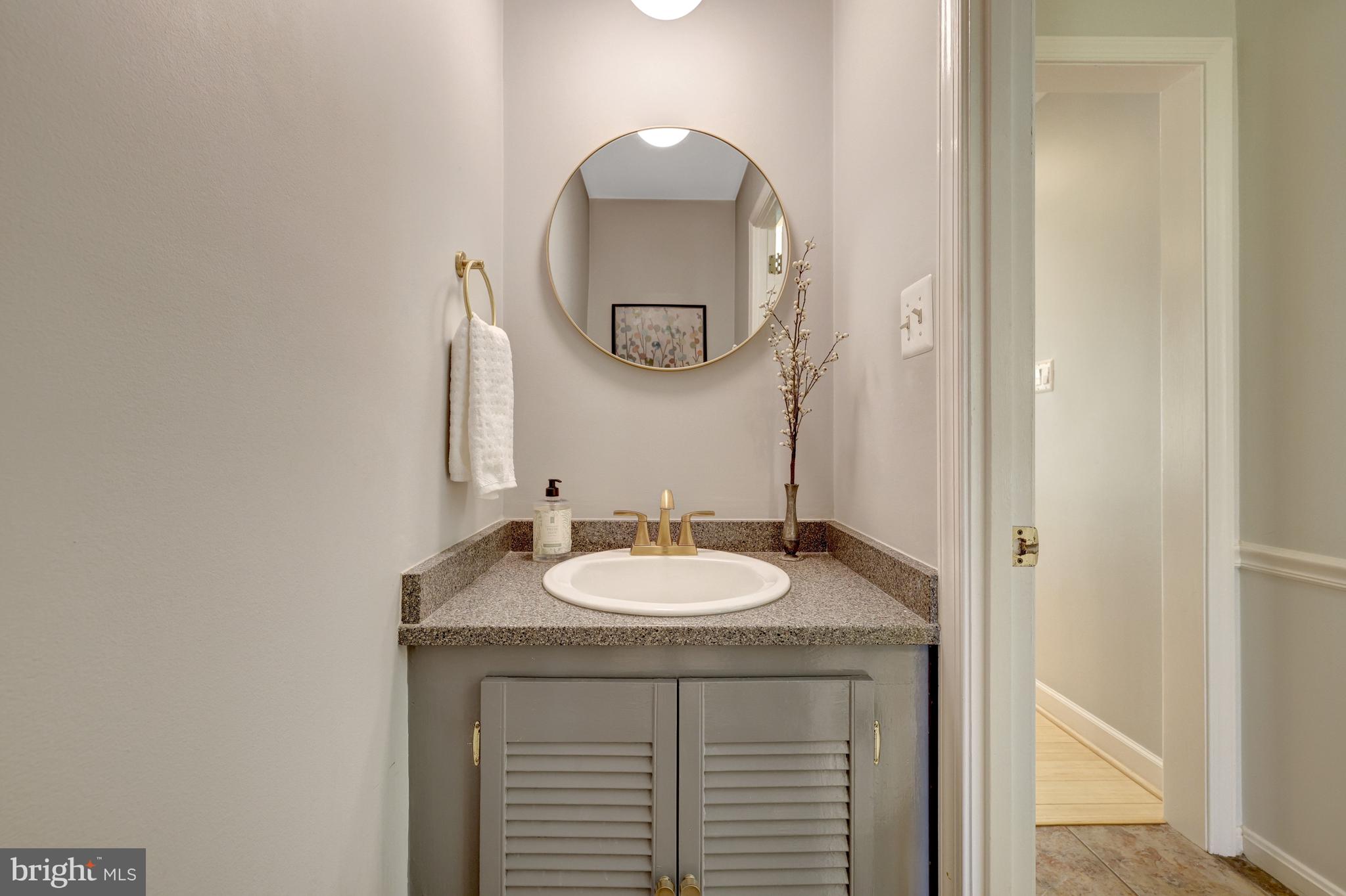 11809 State Rte 4707 Reston, VA 20191 - Photo 28 of 70 Updated main level powder room.