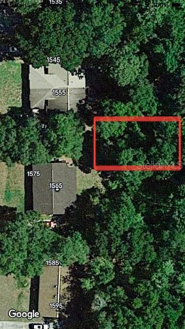 No Street DeLand, FL 32720 - Photo 3 of 5 an aerial view of a house with a yard and tennis court