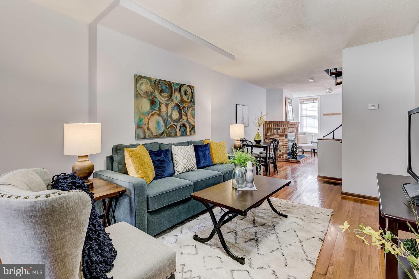 232 East Barney Street Baltimore, MD 21230 - Photo 1 of 23 a living room with furniture and wooden floor
