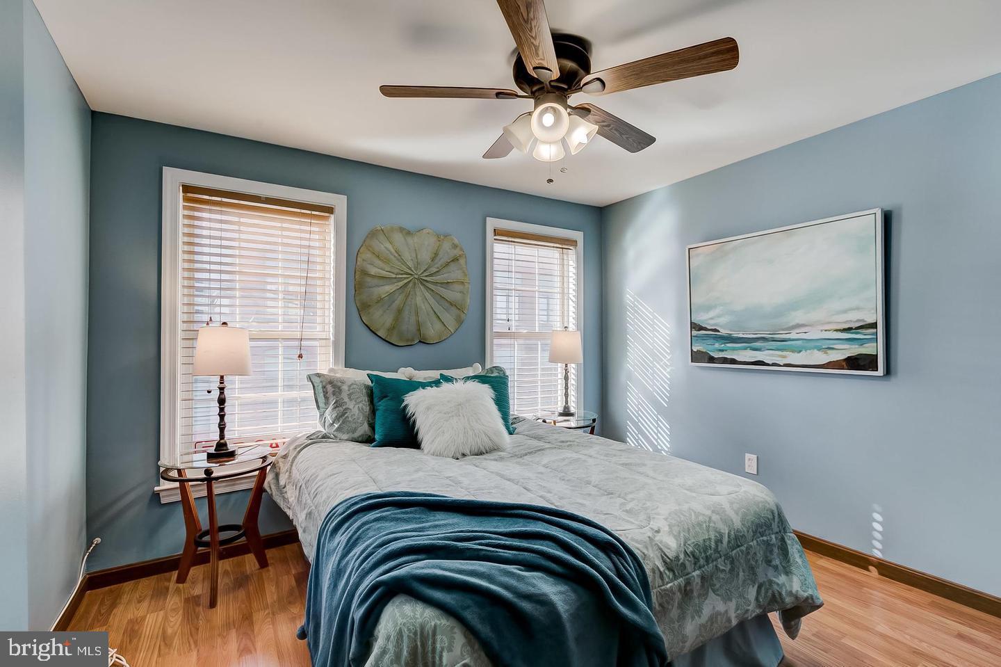 232 East Barney Street Baltimore, MD 21230 - Photo 18 of 23 a bedroom with a bed and a chandelier