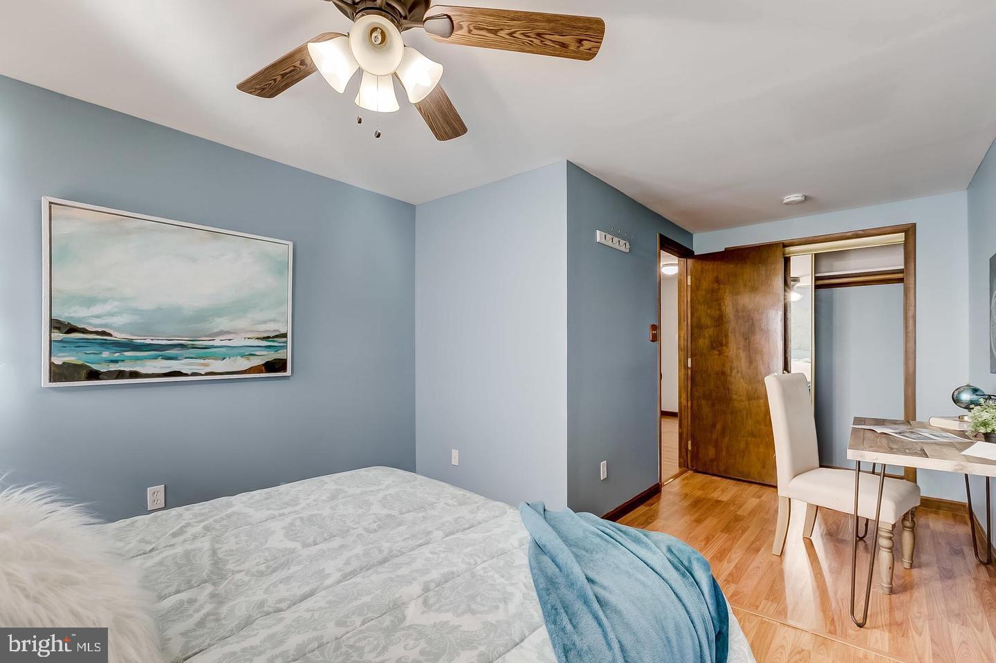232 East Barney Street Baltimore, MD 21230 - Photo 20 of 23 a bedroom with a bed and a chandelier