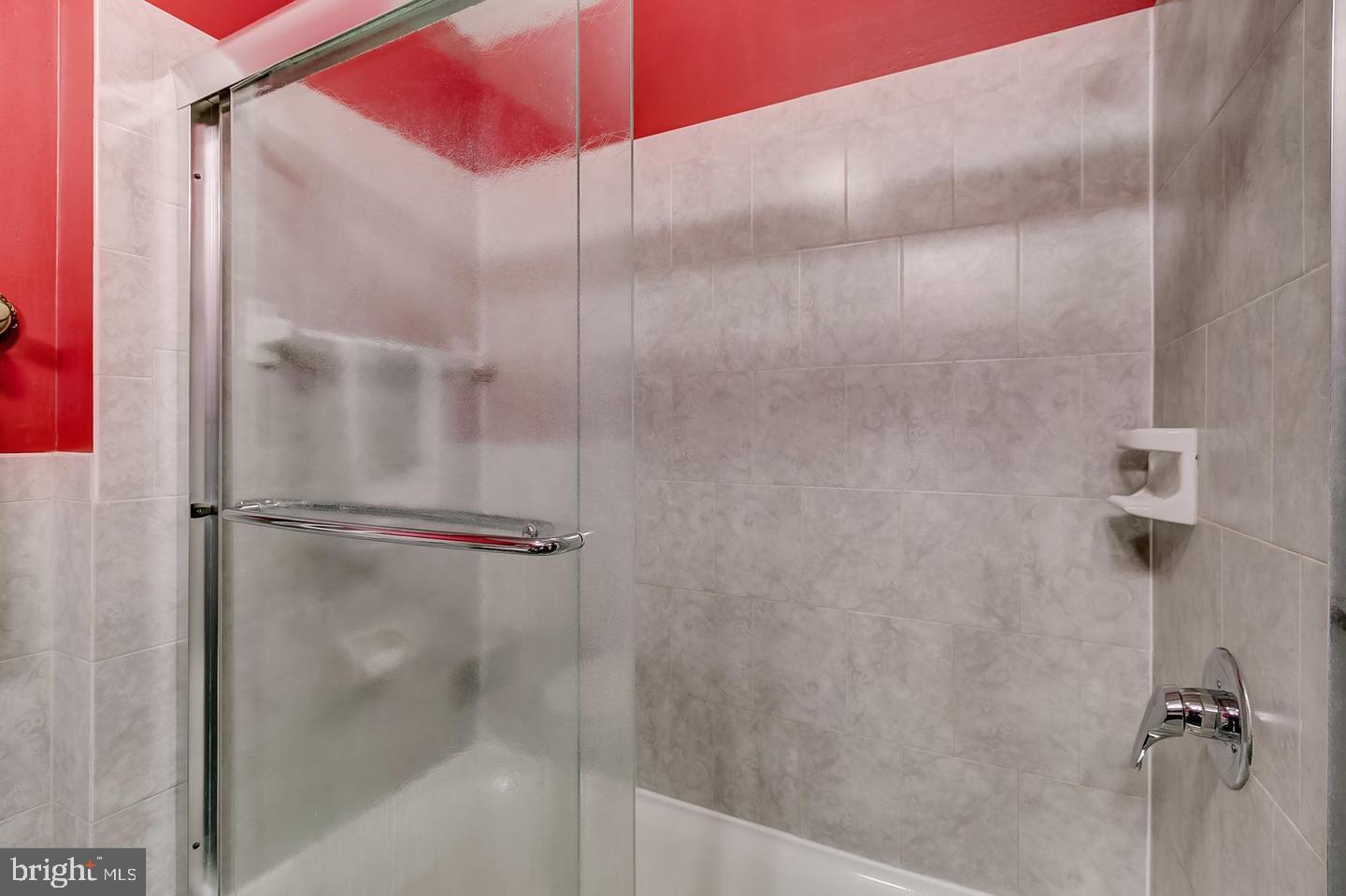 232 East Barney Street Baltimore, MD 21230 - Photo 22 of 23 a bathroom with a glass shower door