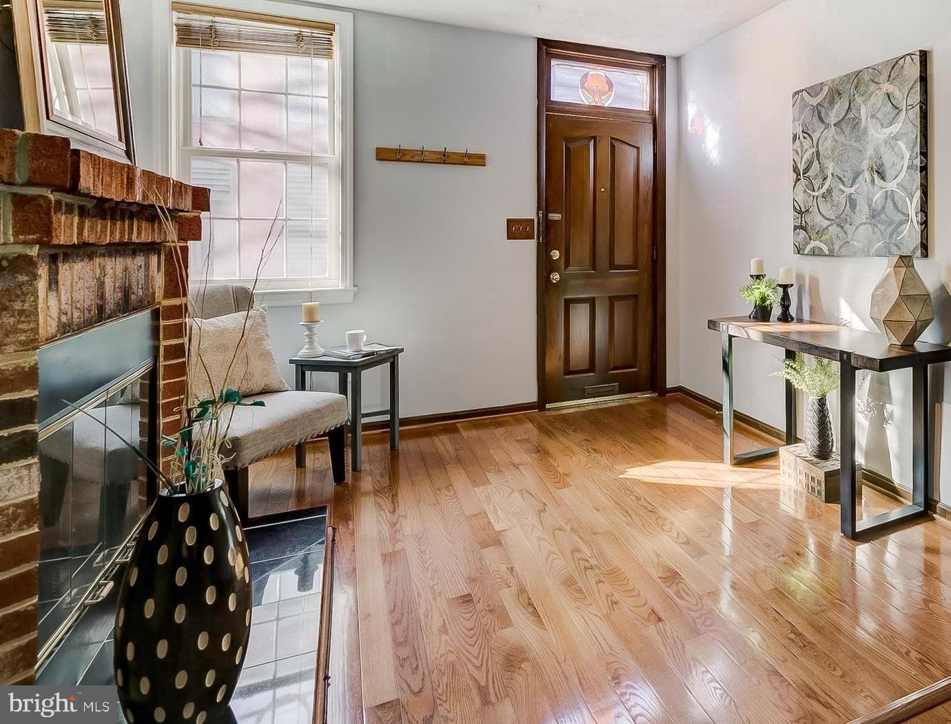 232 East Barney Street Baltimore, MD 21230 - Photo 7 of 23 a livingroom with furniture window and wooden floor