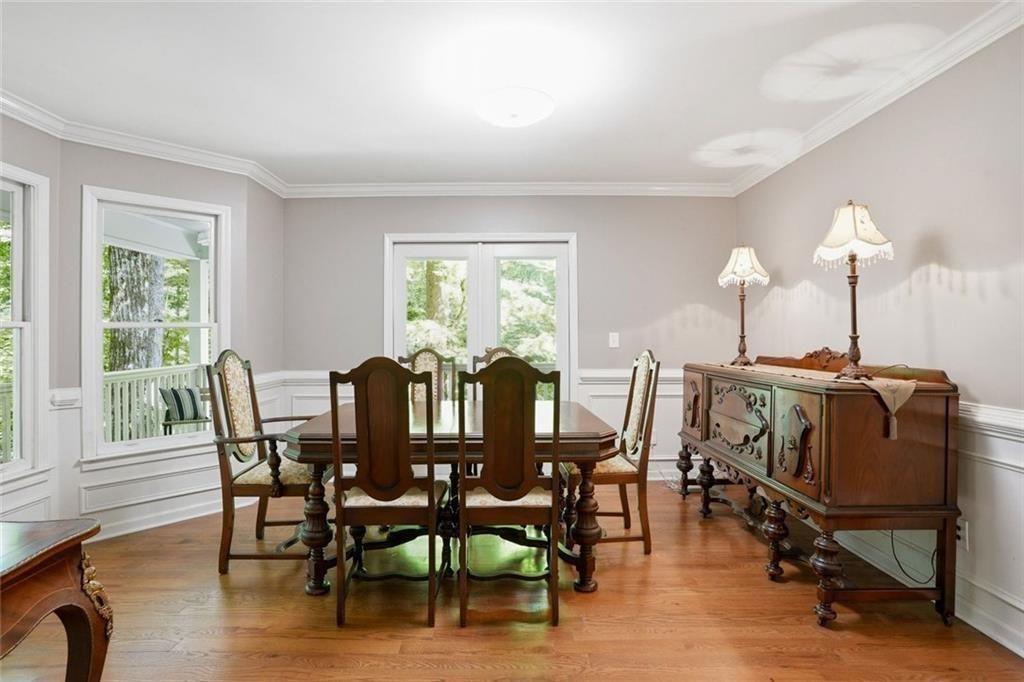 3259 Etchison Road Loganville, GA 30052 - Photo 7 of 50 a view of a dining room with furniture window and wooden floor
