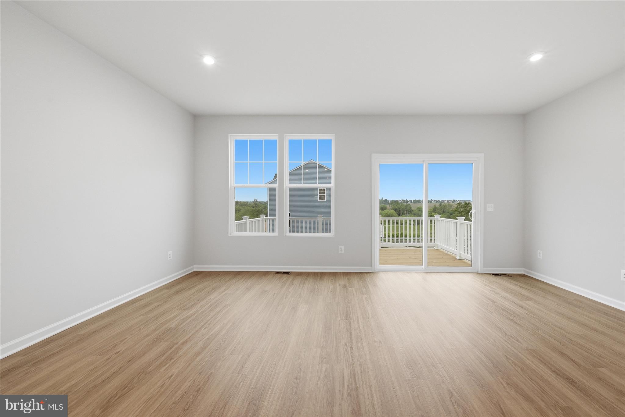 300 Presidents Pointe Avenue Ranson, WV 25438 - Photo 8 of 24 a view of an empty room with wooden floor and a window