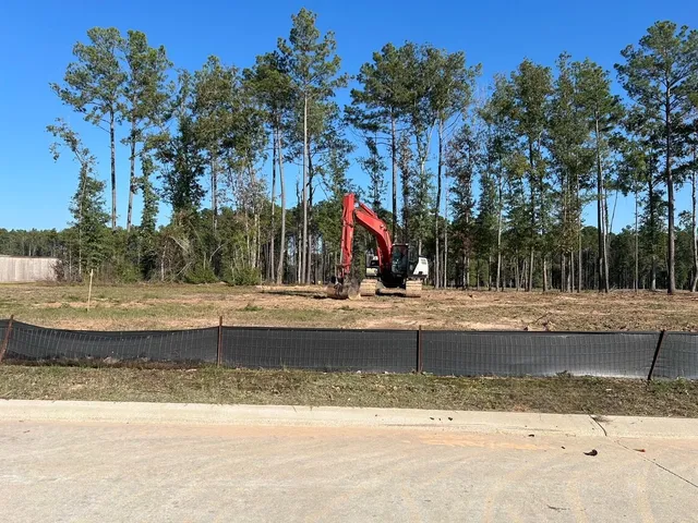 a view of a swimming pool with a yard