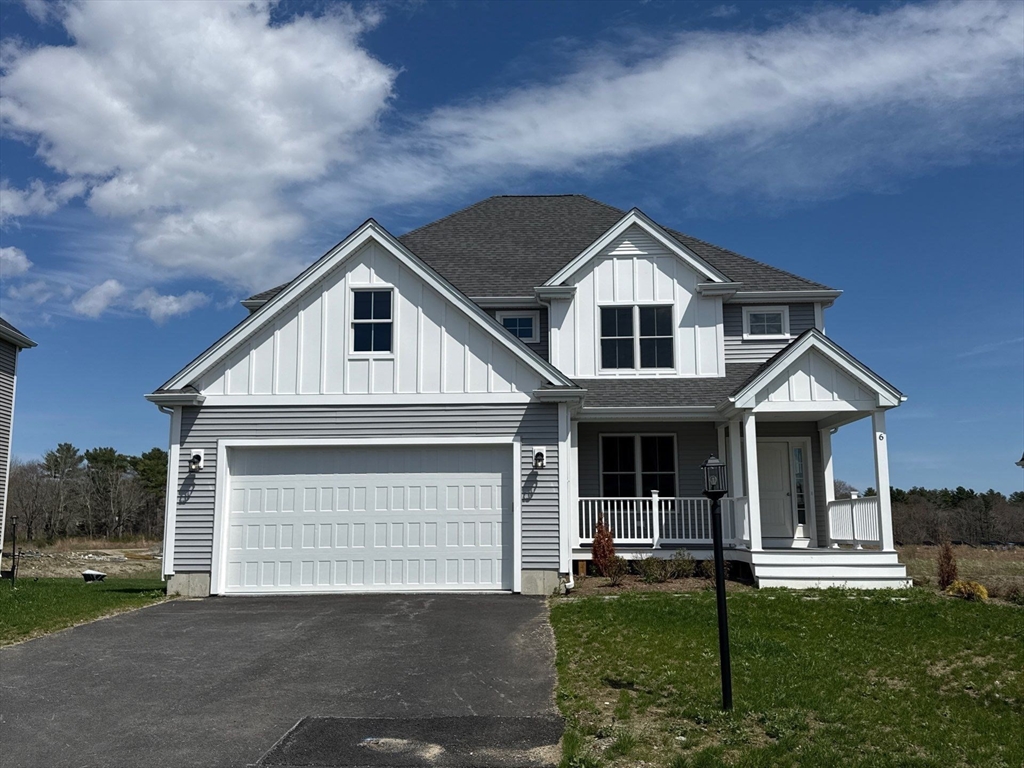 6 Forbes Road, Unit LOT 97 Bridgewater, MA 02324 - Photo 1 of 5 a front view of a house with a yard