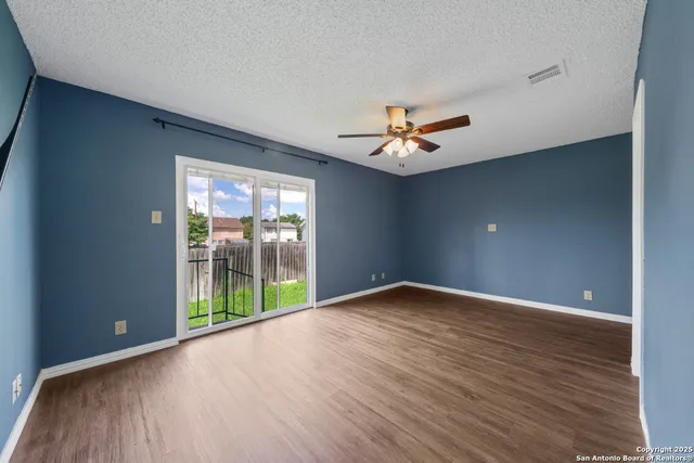 a view of an empty room with a window