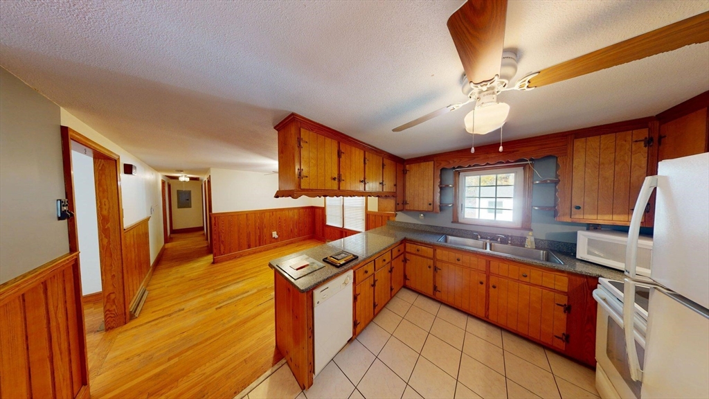 32 Morrison Court Methuen, MA 01844 - Photo 6 of 18 a kitchen with stainless steel appliances granite countertop a sink and cabinets