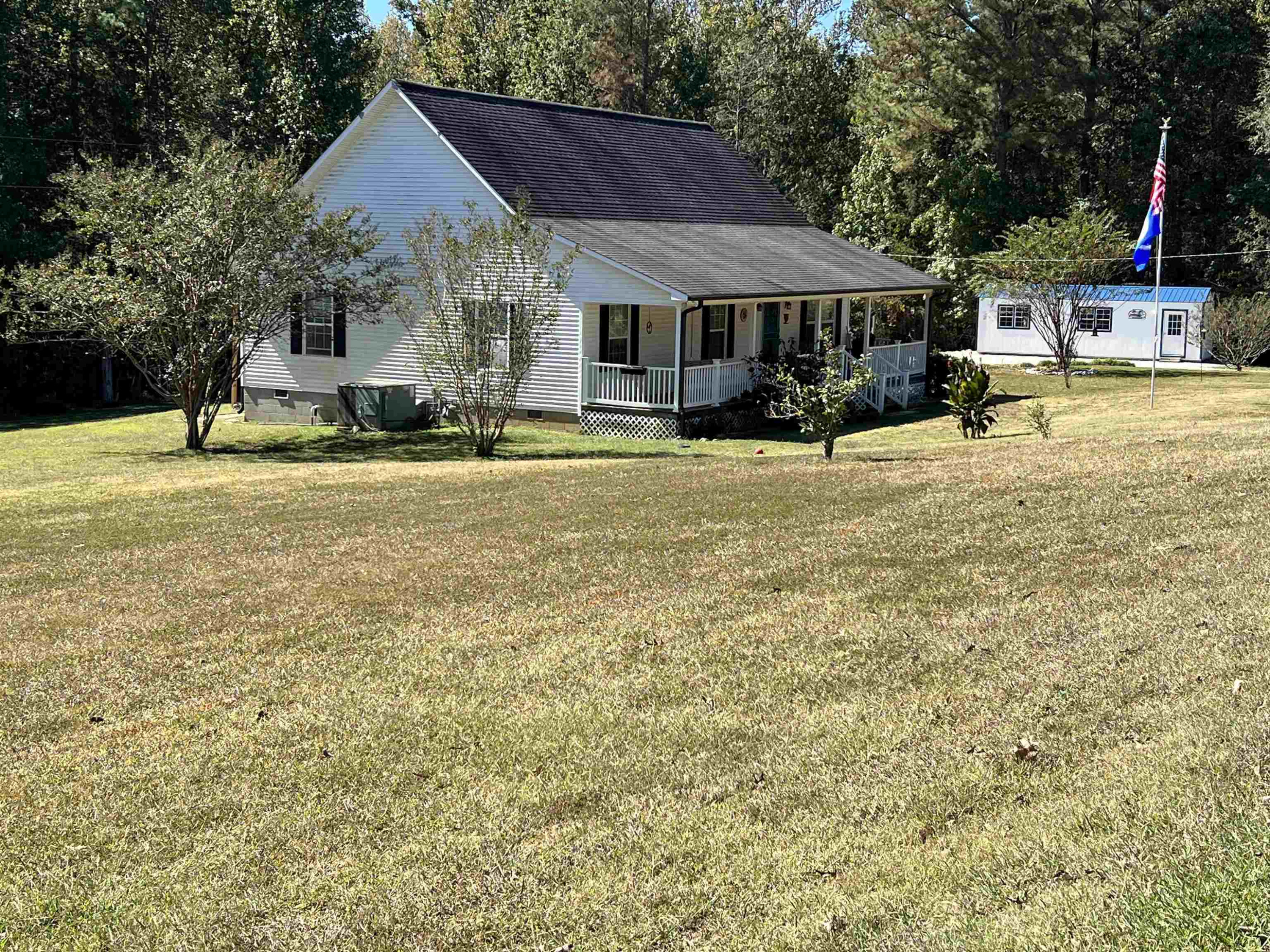 235 Willis Road Sardis, TN 38371 - Photo 2 of 38 a front view of a house with swimming pool