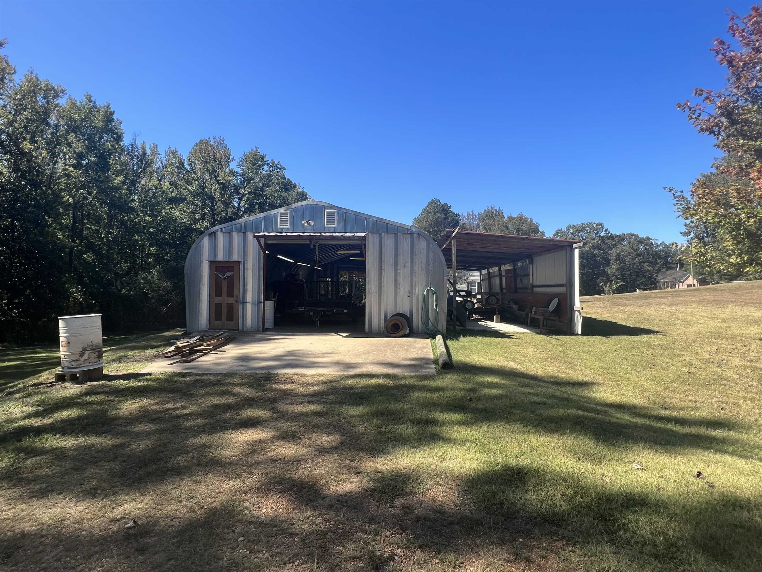 235 Willis Road Sardis, TN 38371 - Photo 29 of 38 a view of a house with a yard and garage