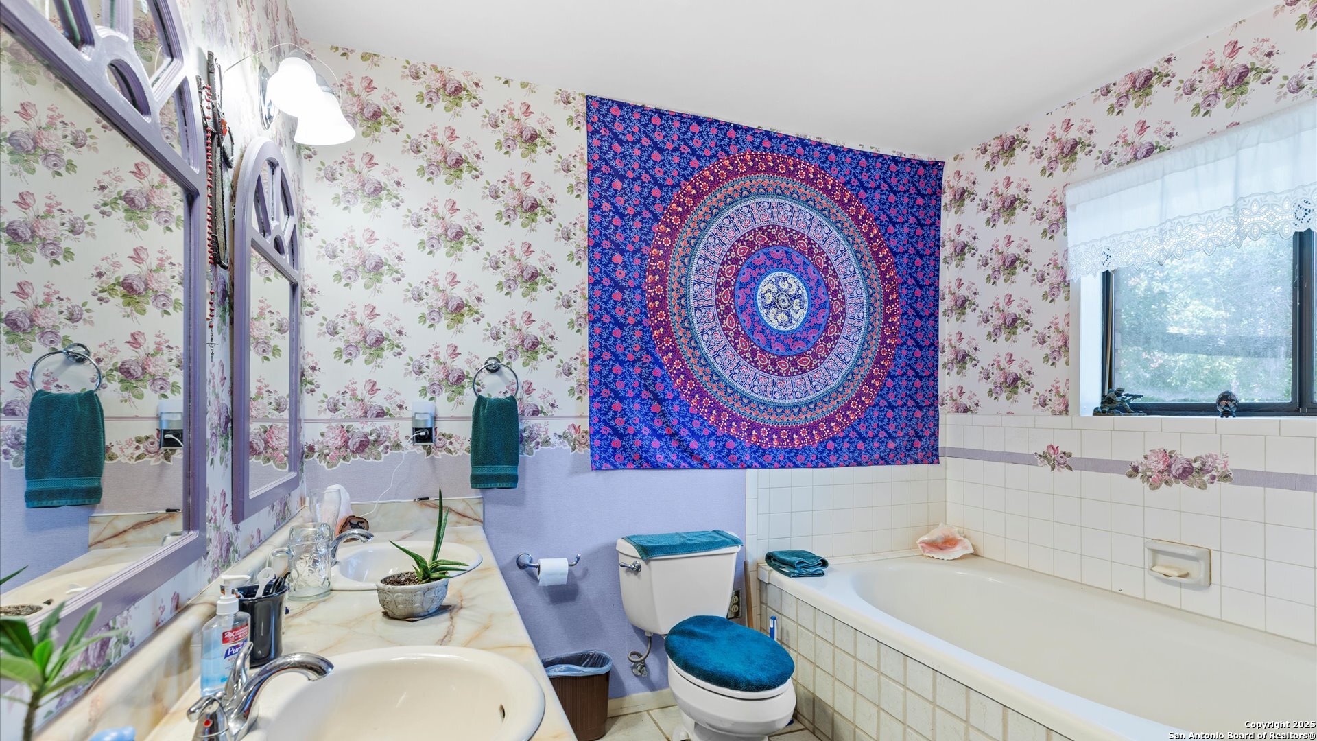 949 Burges Street Seguin, TX 78155 - Photo 15 of 26 a bathroom with a sink and a mirror