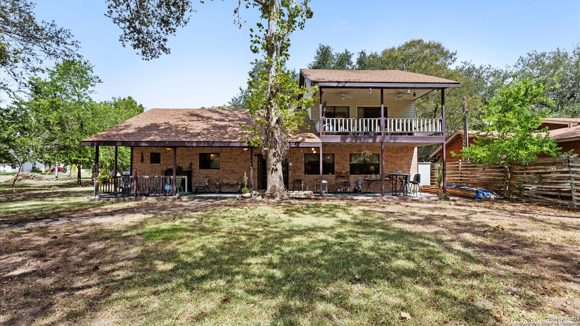 949 Burges Street Seguin, TX 78155 - Photo 25 of 26 a front view of a house with yard porch and furniture