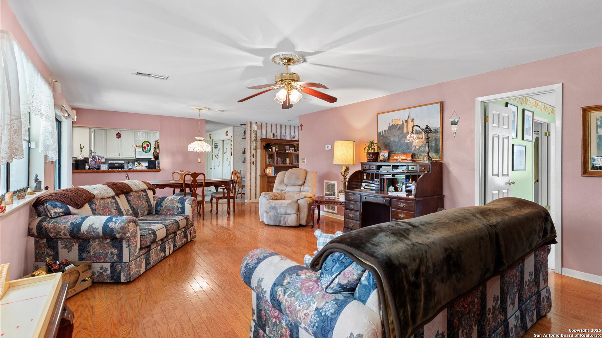 949 Burges Street Seguin, TX 78155 - Photo 6 of 26 a living room with furniture dining area and a chandelier