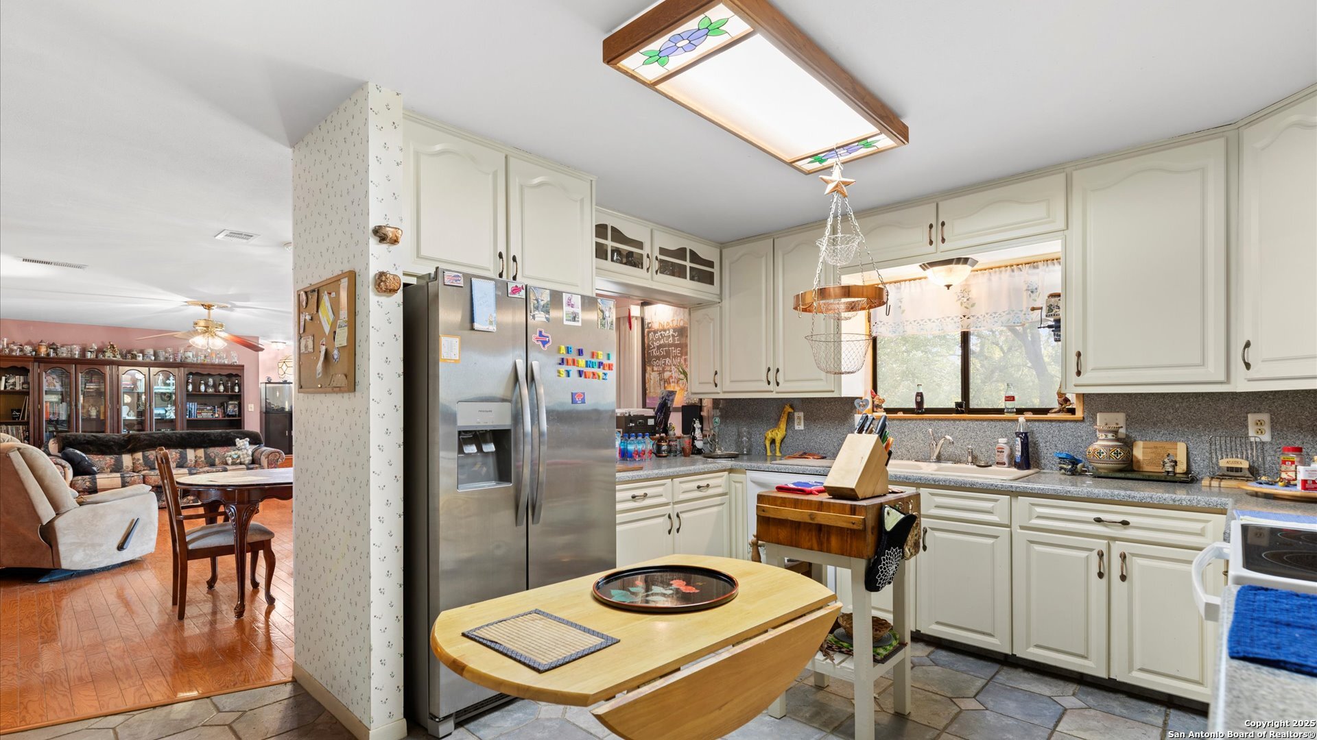 949 Burges Street Seguin, TX 78155 - Photo 10 of 26 a kitchen with stainless steel appliances granite countertop a refrigerator sink and stove