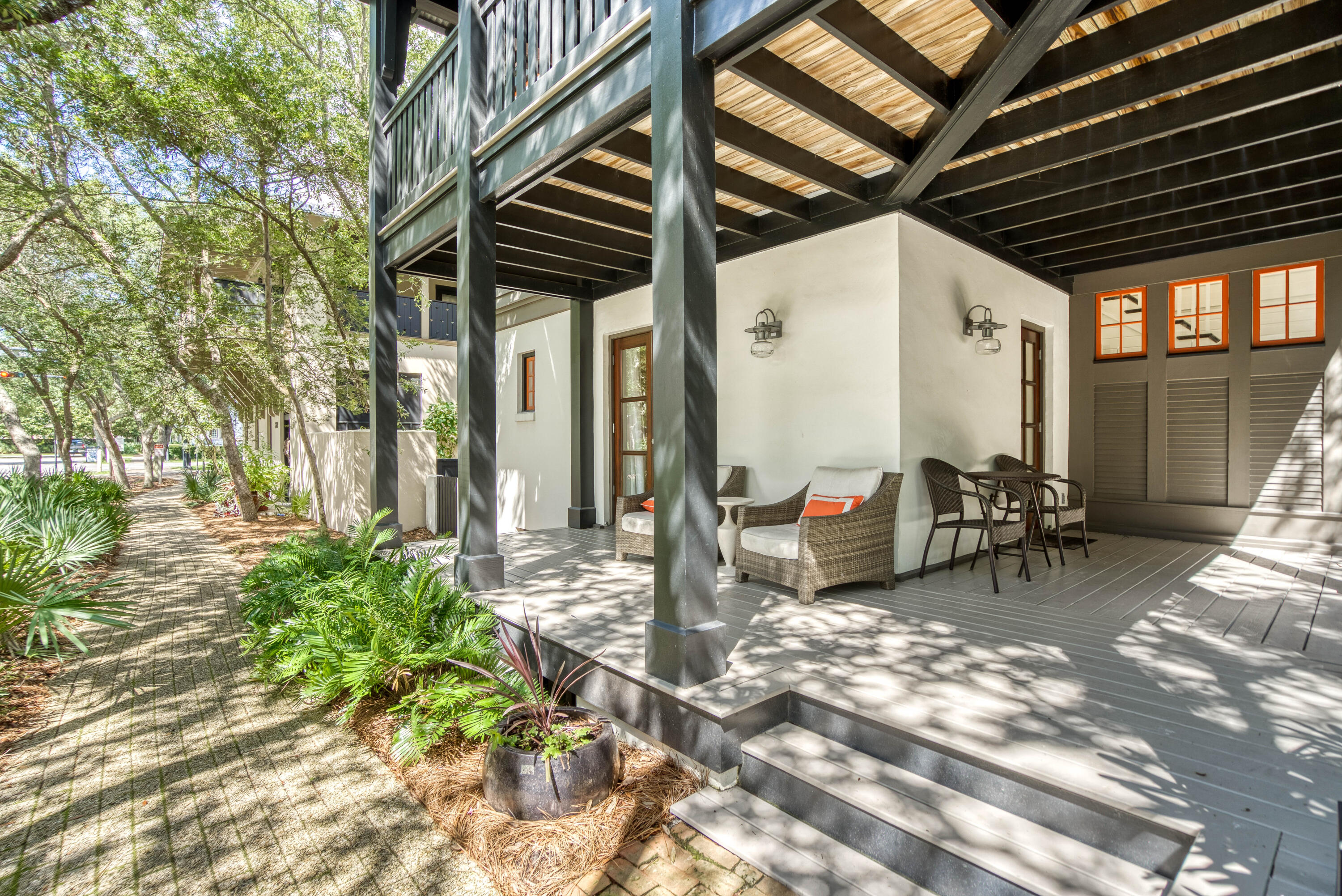277 East Water Street Inlet Beach, FL 32461 - Photo 5 of 30 a view of a patio with table and chairs and wooden floor