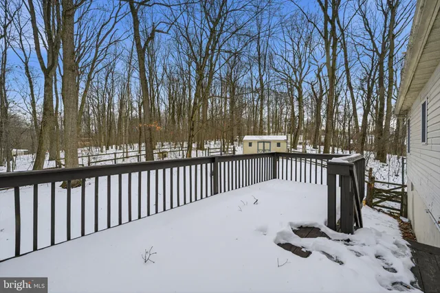 a view of balcony with wooden floor and outdoor seating
