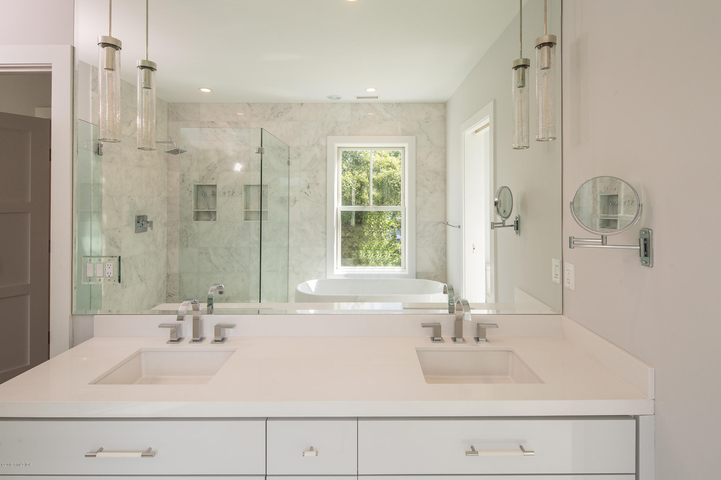 38 St Roch Avenue, Unit B Greenwich, CT 06830 - Photo 15 of 38 a bathroom with a bathtub shower sink and a mirror