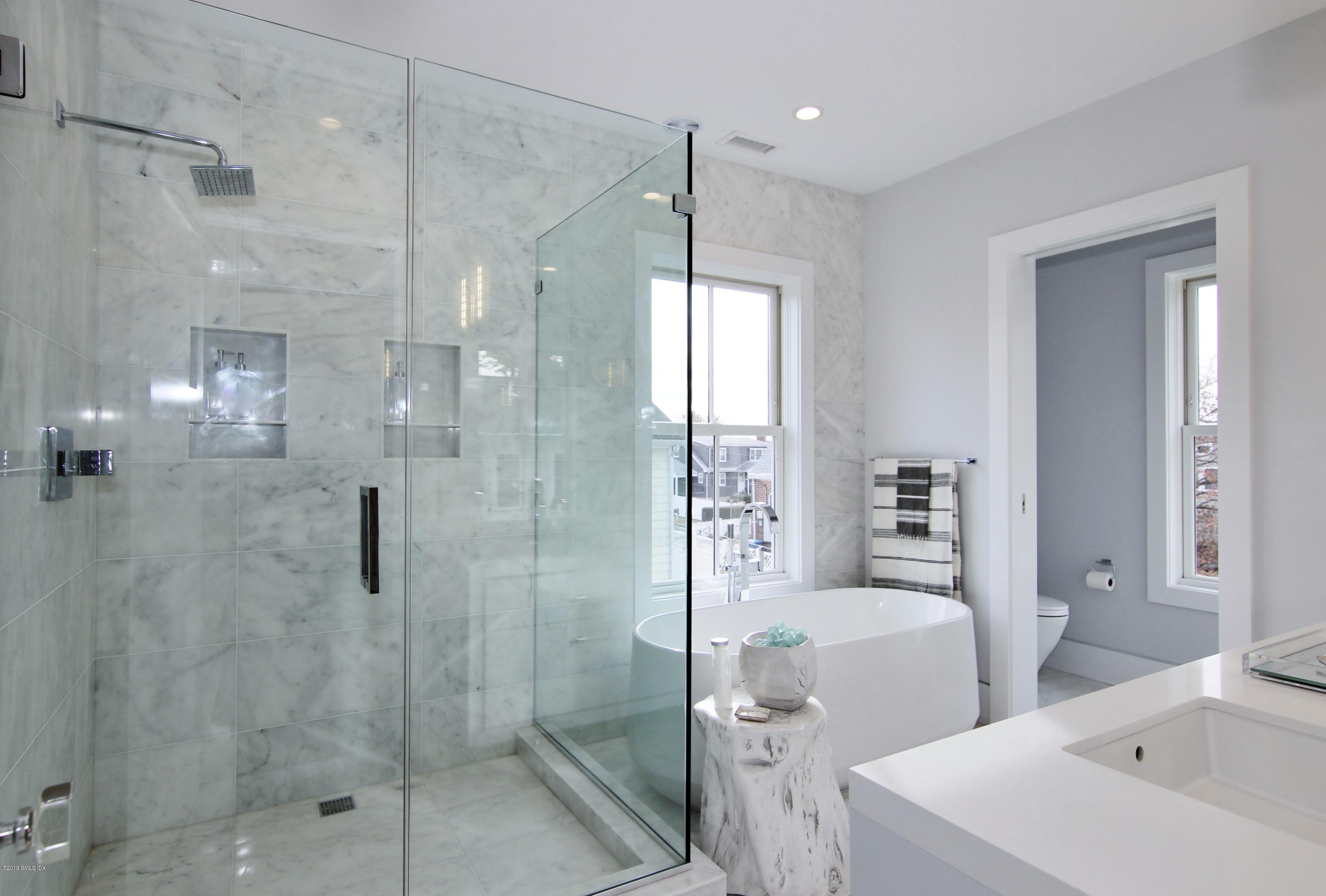 38 St Roch Avenue, Unit B Greenwich, CT 06830 - Photo 16 of 38 a bathroom with a toilet a sink and shower