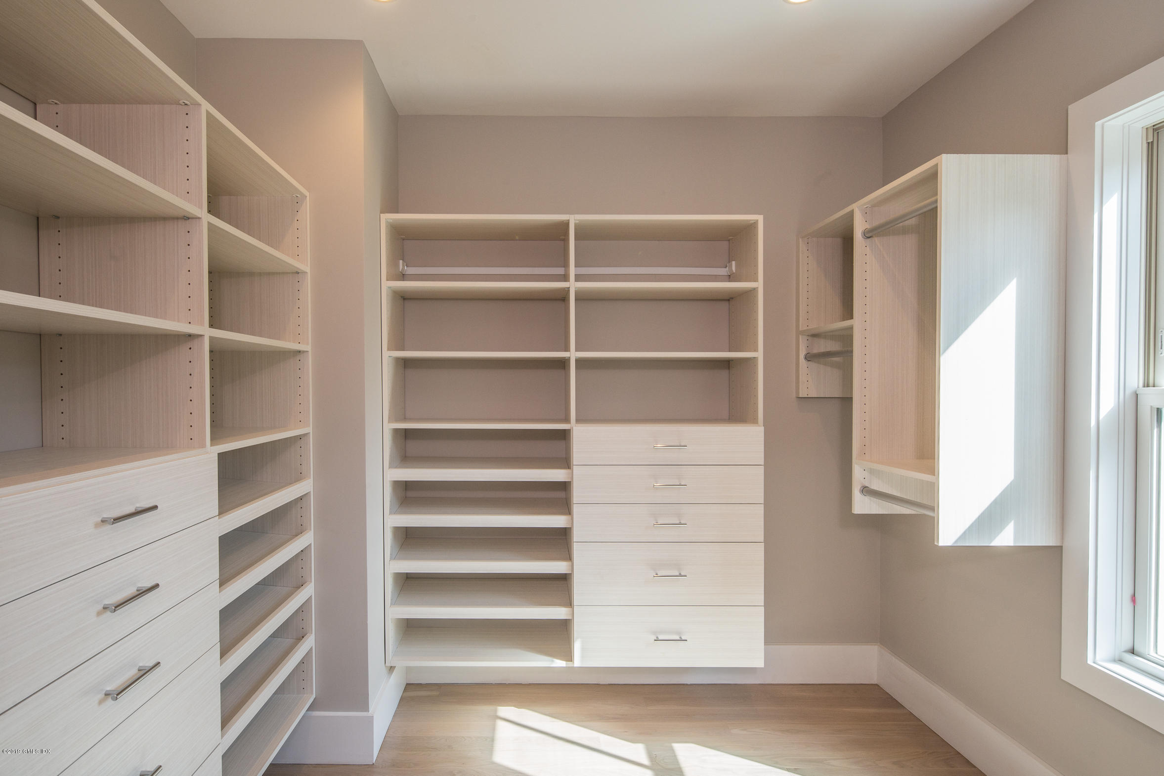 38 St Roch Avenue, Unit B Greenwich, CT 06830 - Photo 18 of 38 a view of walk in closet with empty racks