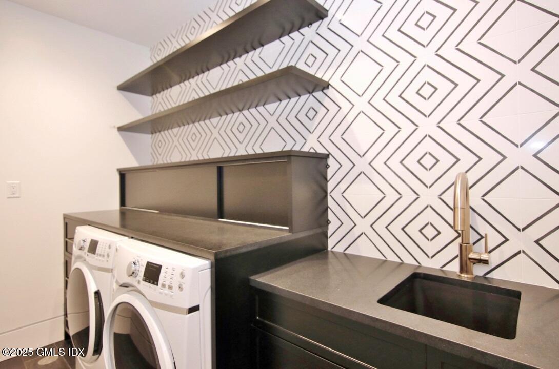 38 St Roch Avenue, Unit B Greenwich, CT 06830 - Photo 22 of 38 a utility room with dryer and washer