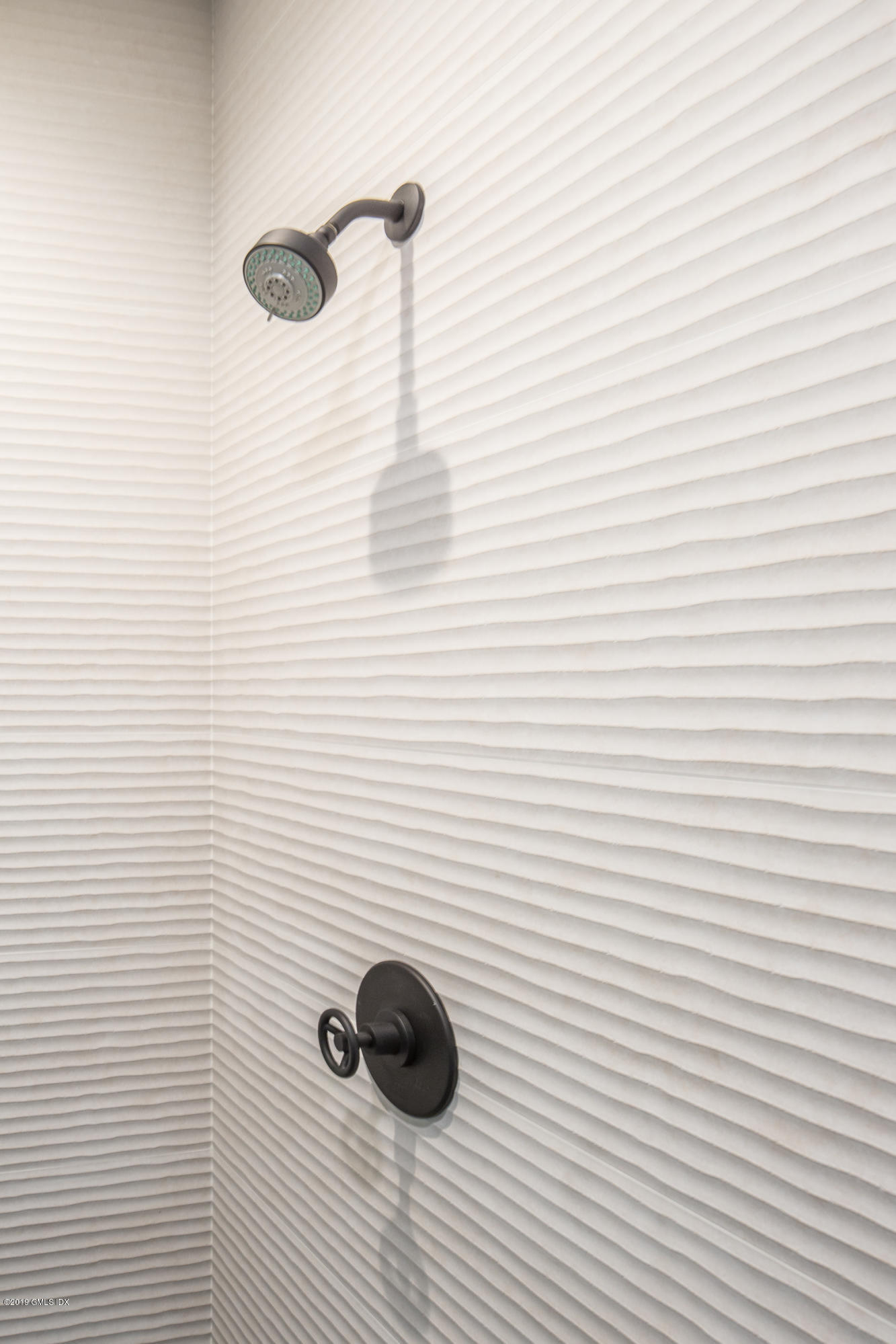 38 St Roch Avenue, Unit B Greenwich, CT 06830 - Photo 26 of 38 a bathroom with a shower