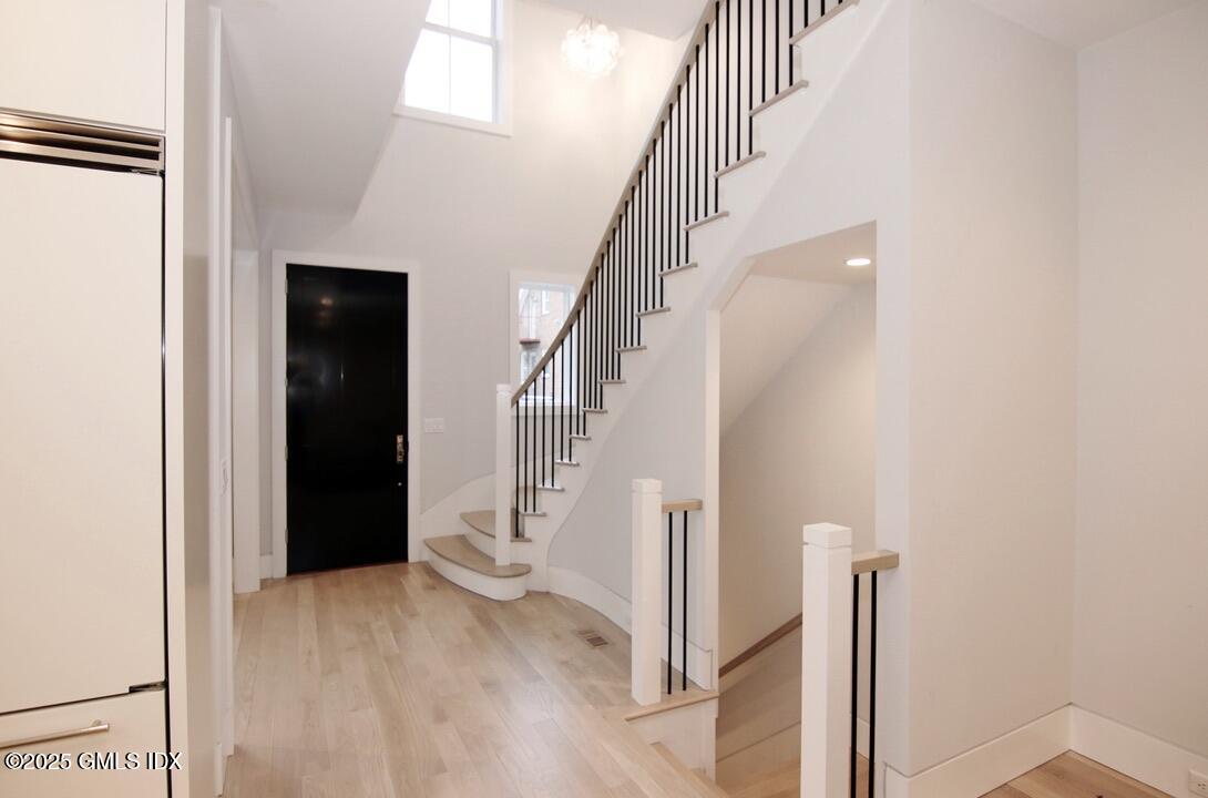 38 St Roch Avenue, Unit B Greenwich, CT 06830 - Photo 3 of 38 a view of entryway and hall with wooden floor