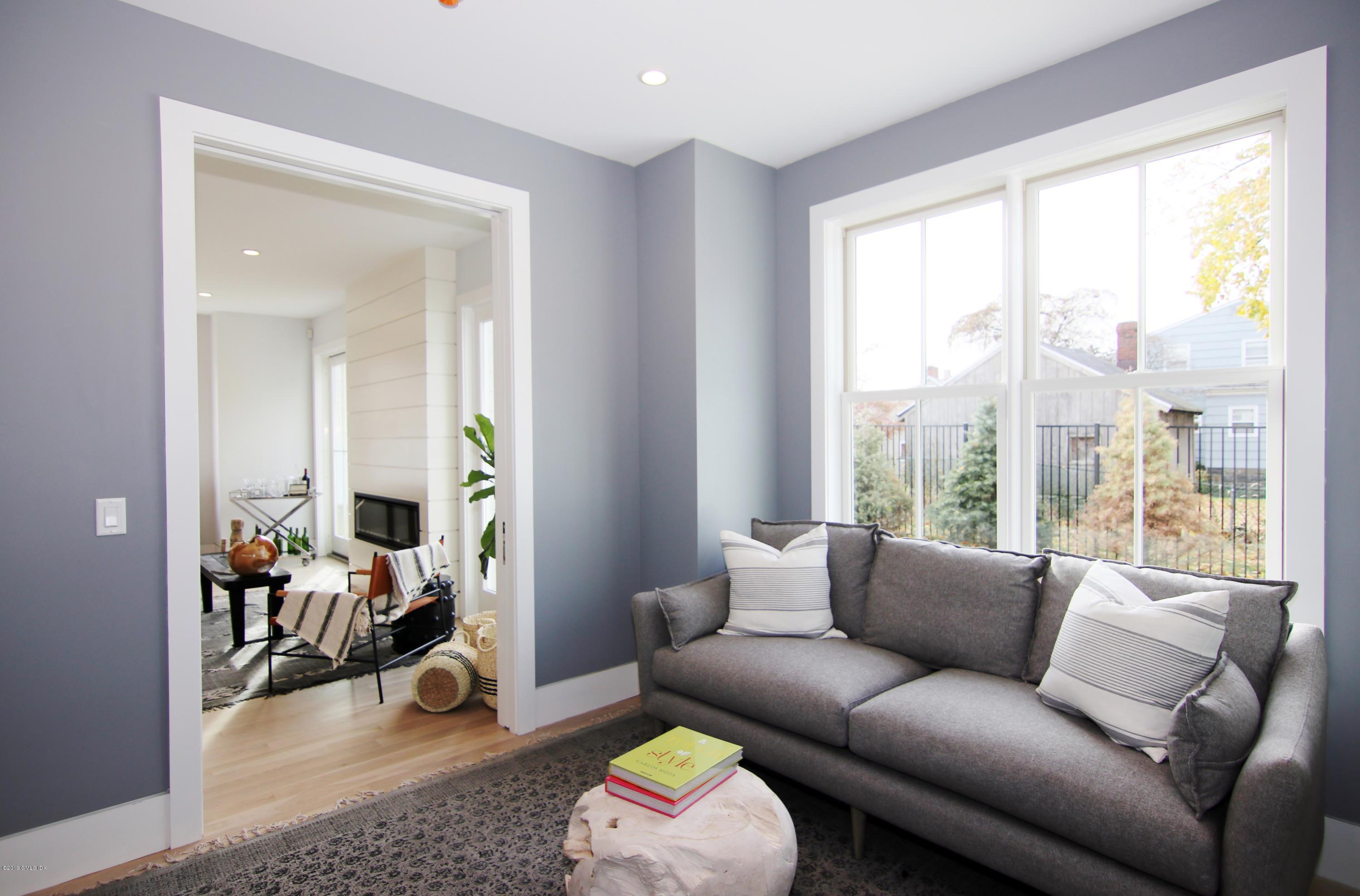 38 St Roch Avenue, Unit B Greenwich, CT 06830 - Photo 10 of 38 a living room with furniture and a large window