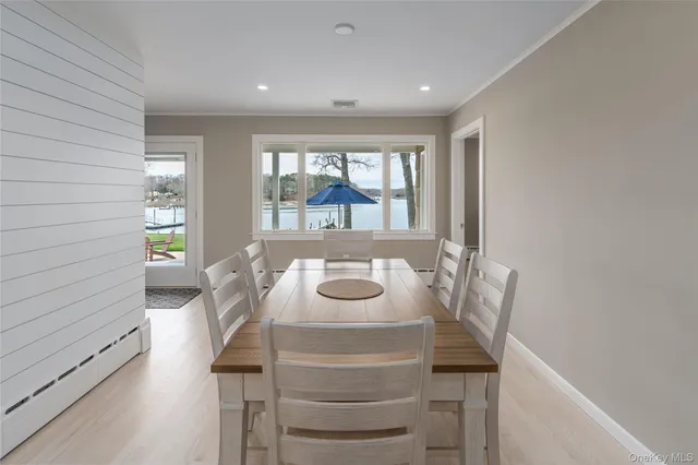 a view of a dining room with furniture window and outside view