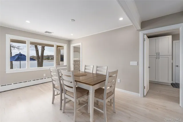a dining room with furniture and window