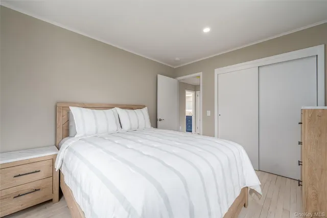 a large bed sitting in a bedroom and closet