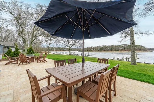an outdoor space with furniture and umbrella