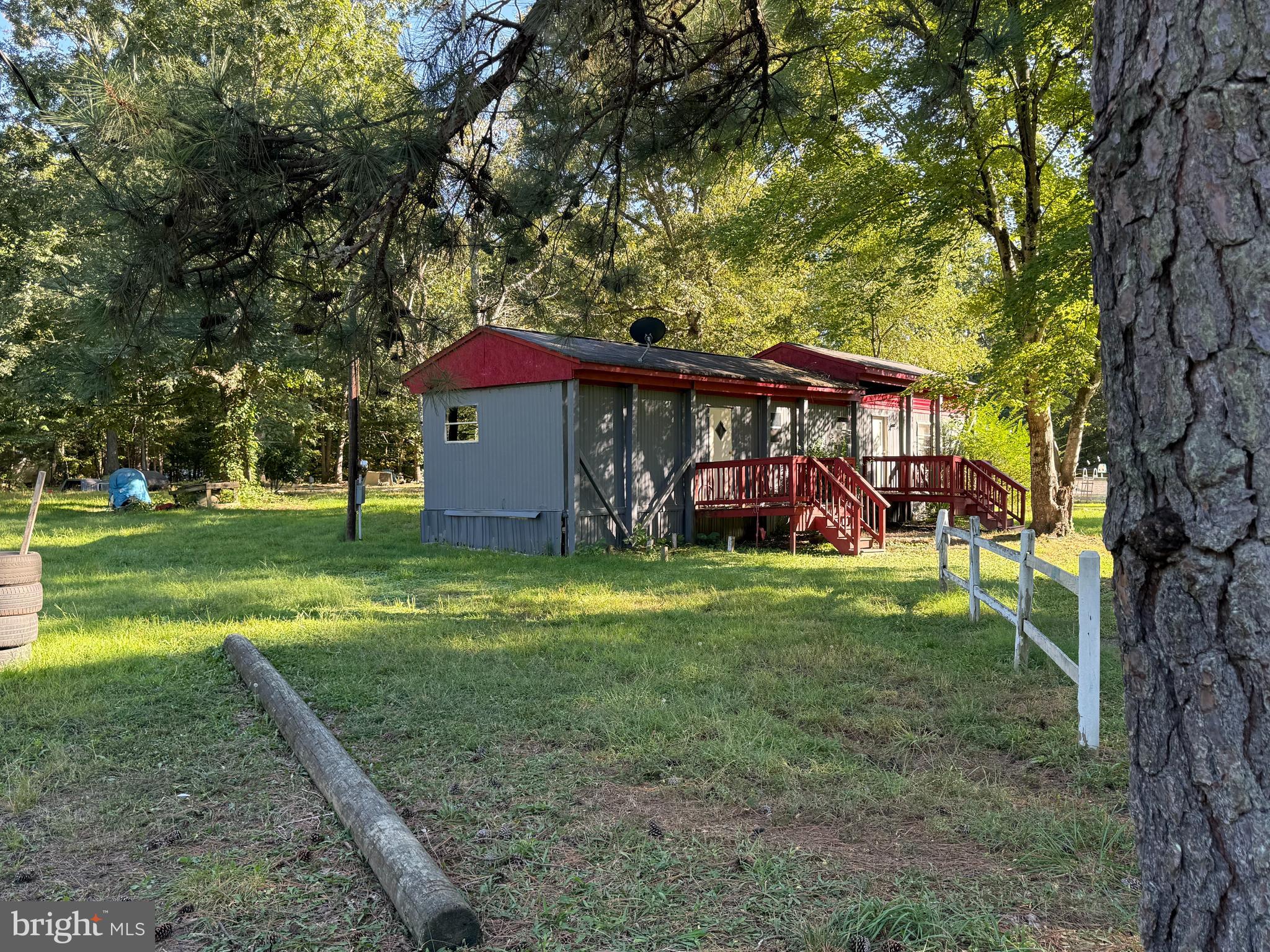 14405 Millbank Road King George, VA 22485 - Photo 18 of 20 a view of a yard in front of a house with a large tree