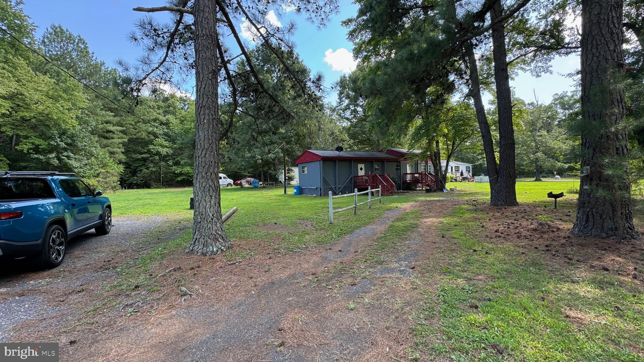 14405 Millbank Road King George, VA 22485 - Photo 19 of 20 a view of a house with a yard and tree s