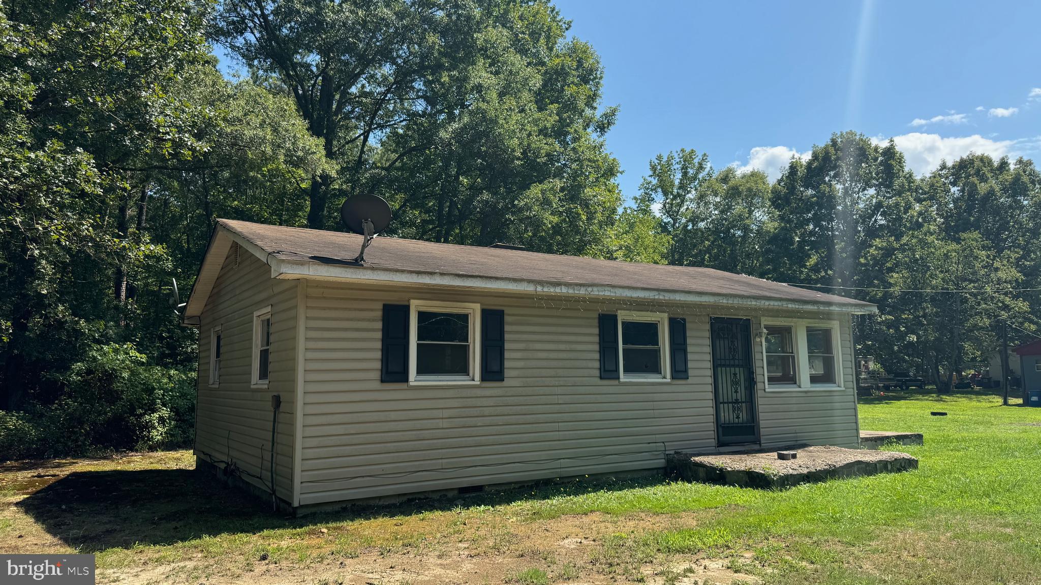 14405 Millbank Road King George, VA 22485 - Photo 5 of 20 a front view of a house with a yard