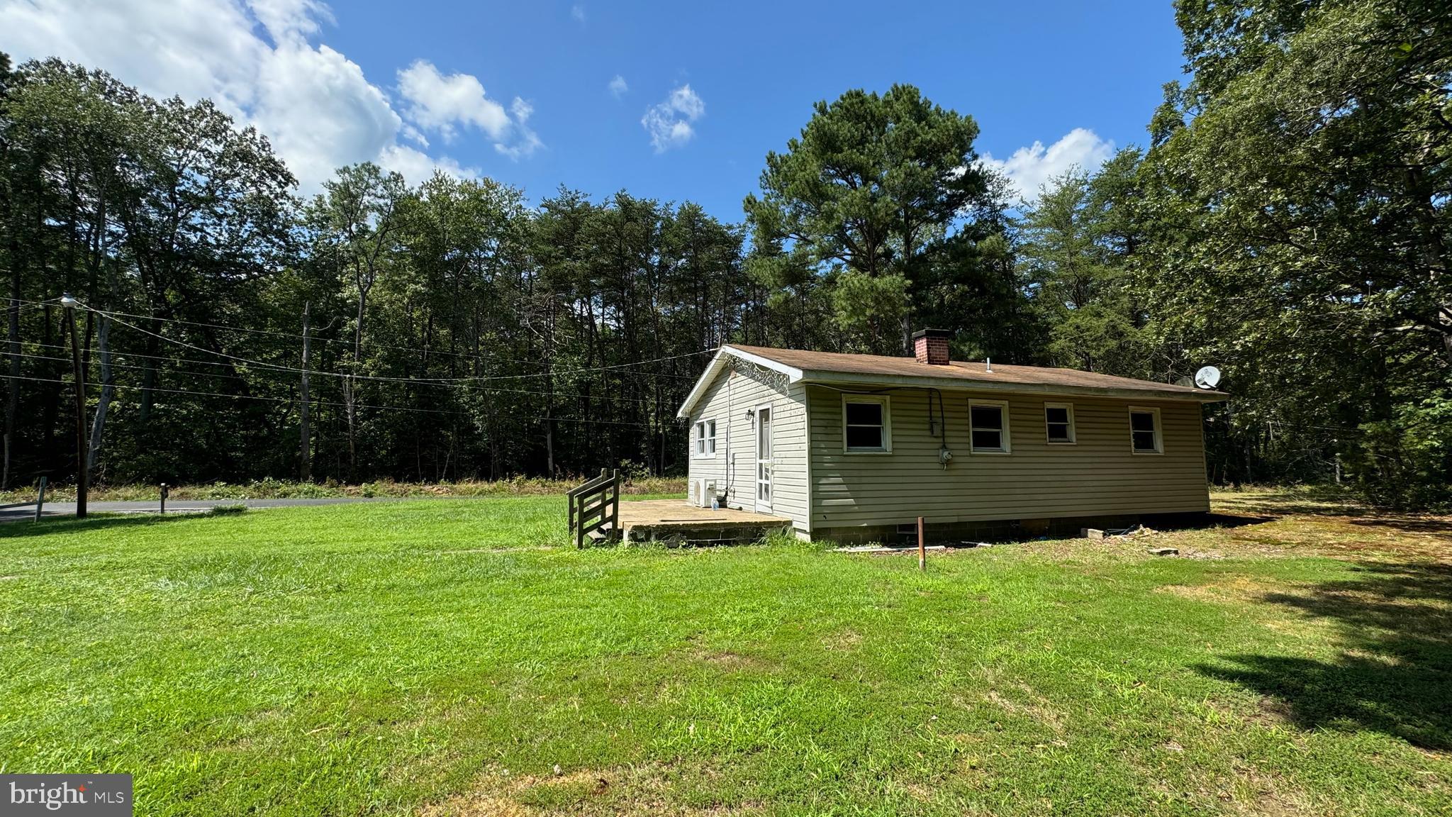 14405 Millbank Road King George, VA 22485 - Photo 10 of 20 a view of a house with a yard
