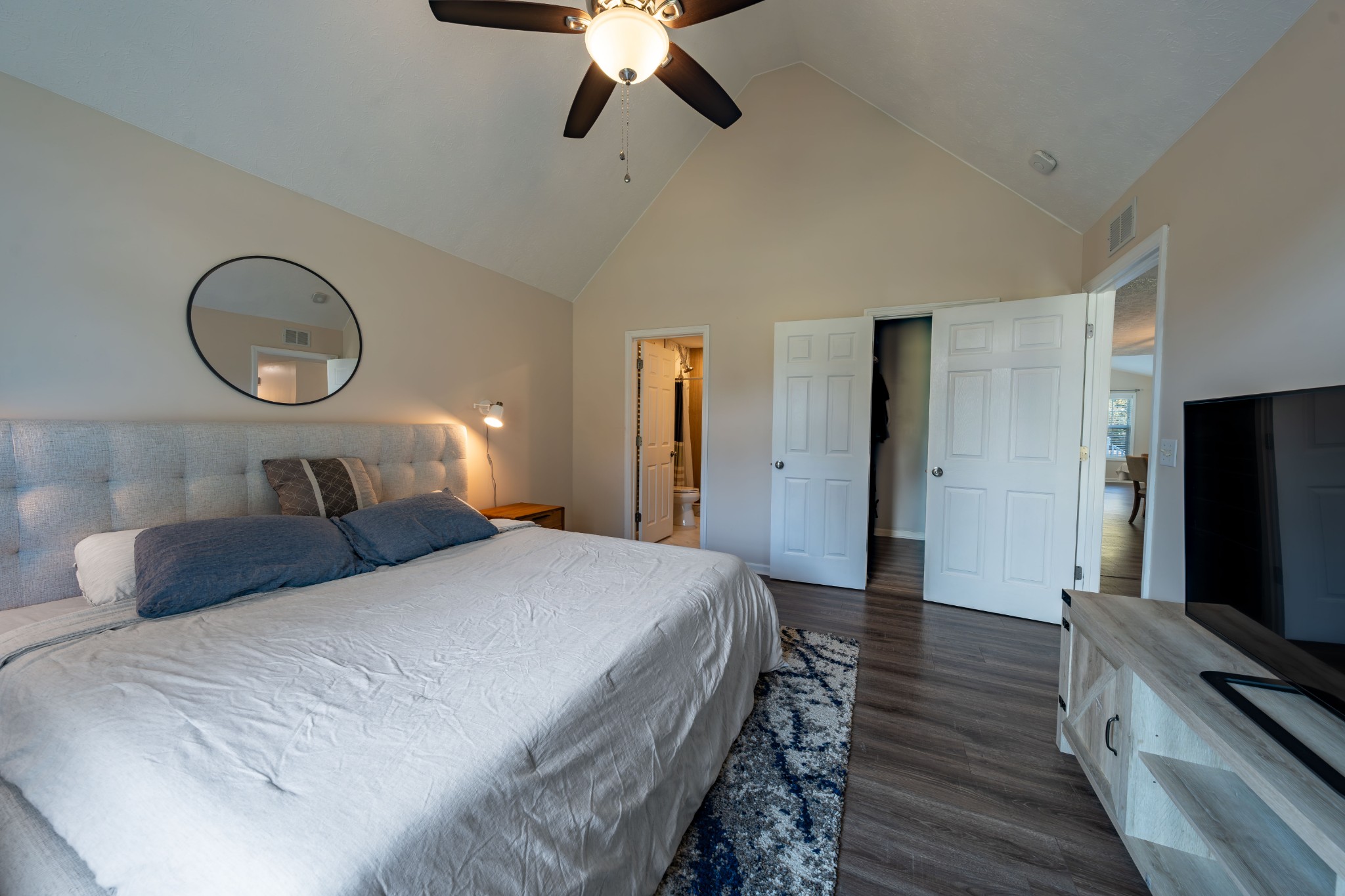 3053 Academy Road Portland, TN 37148 - Photo 34 of 45 a bedroom with a bed and a flat tv screen on dresser