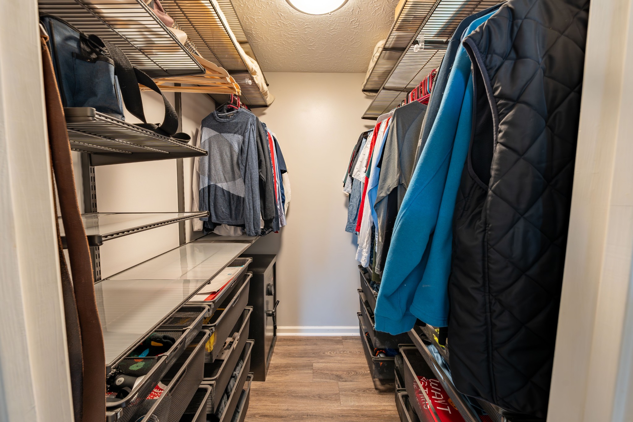 3053 Academy Road Portland, TN 37148 - Photo 35 of 45 a view of walk in closet with clothes and shoes
