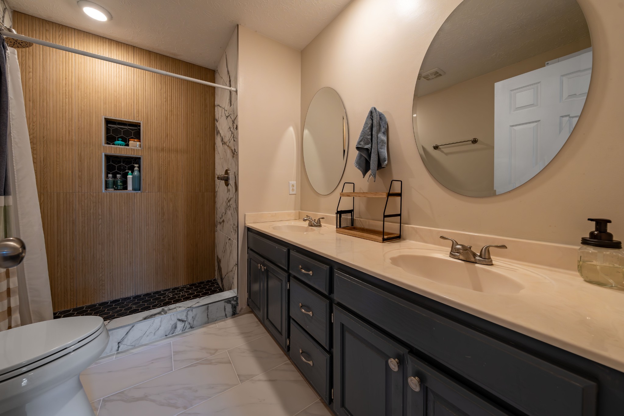 3053 Academy Road Portland, TN 37148 - Photo 36 of 45 a bathroom with a double vanity sink and a mirror