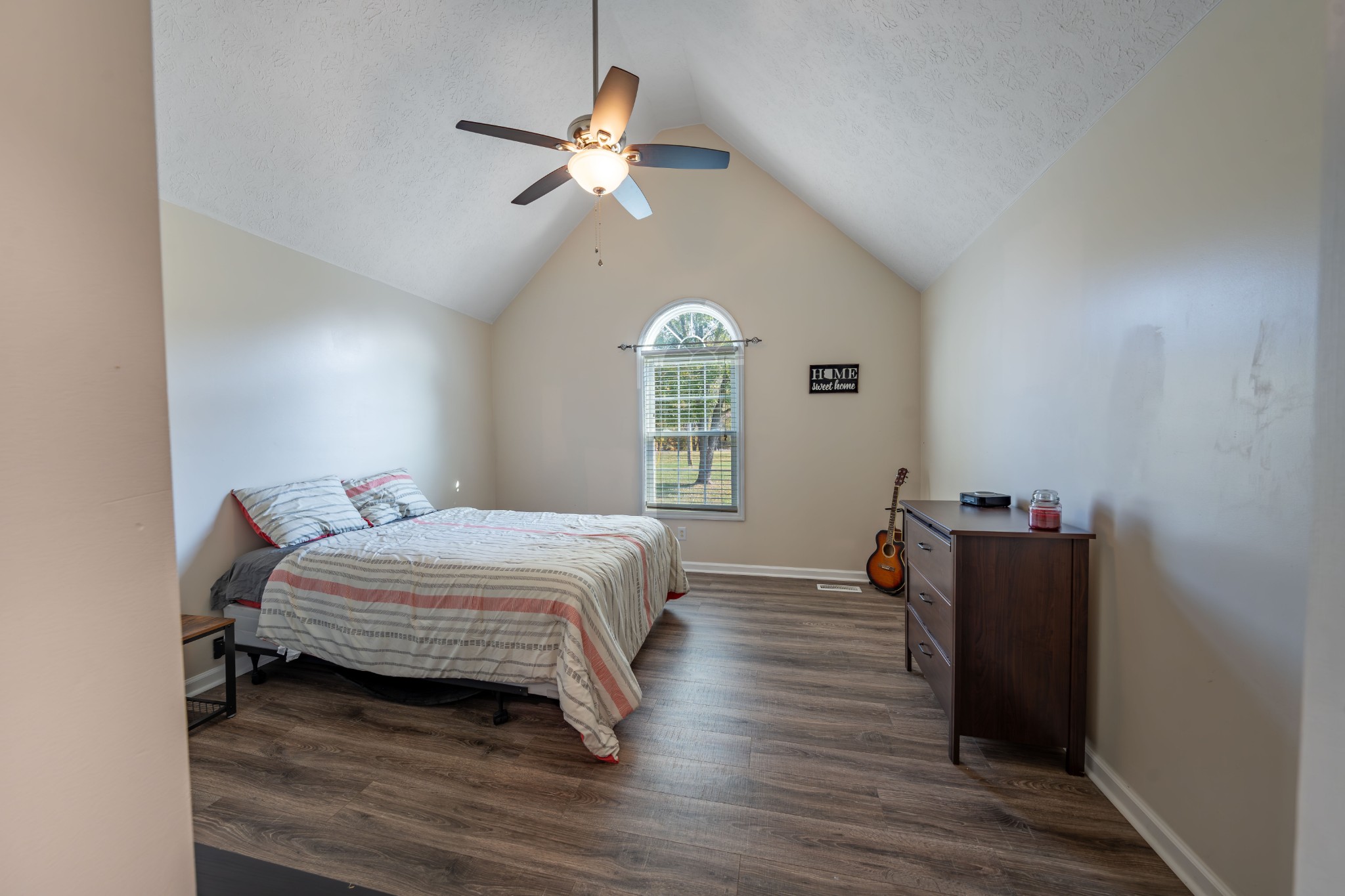 3053 Academy Road Portland, TN 37148 - Photo 38 of 45 a bedroom with a bed and a chandelier