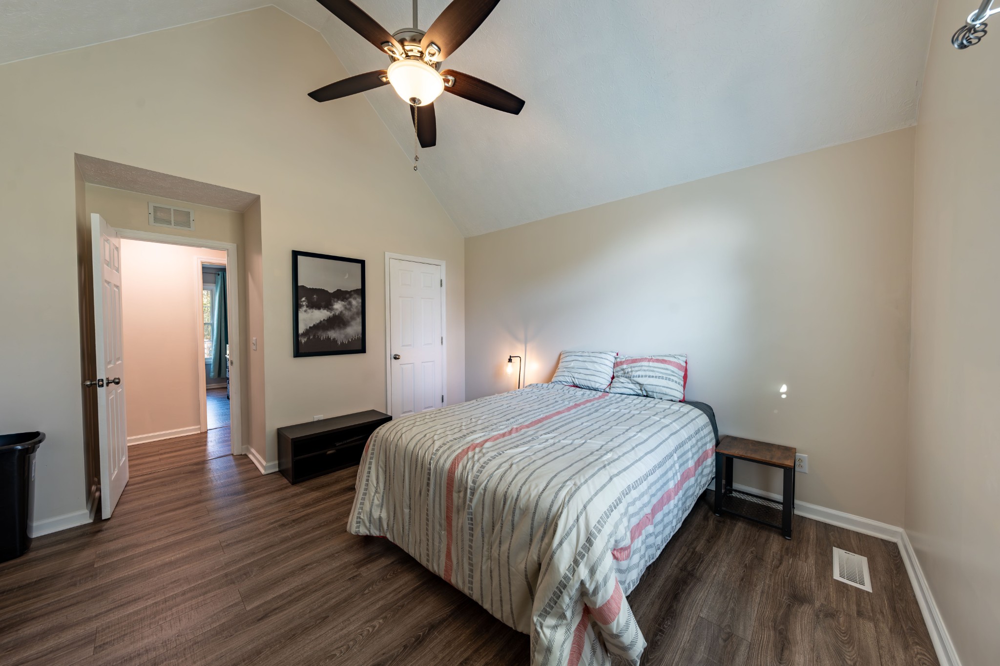 3053 Academy Road Portland, TN 37148 - Photo 39 of 45 a bedroom with a bed and wooden floor