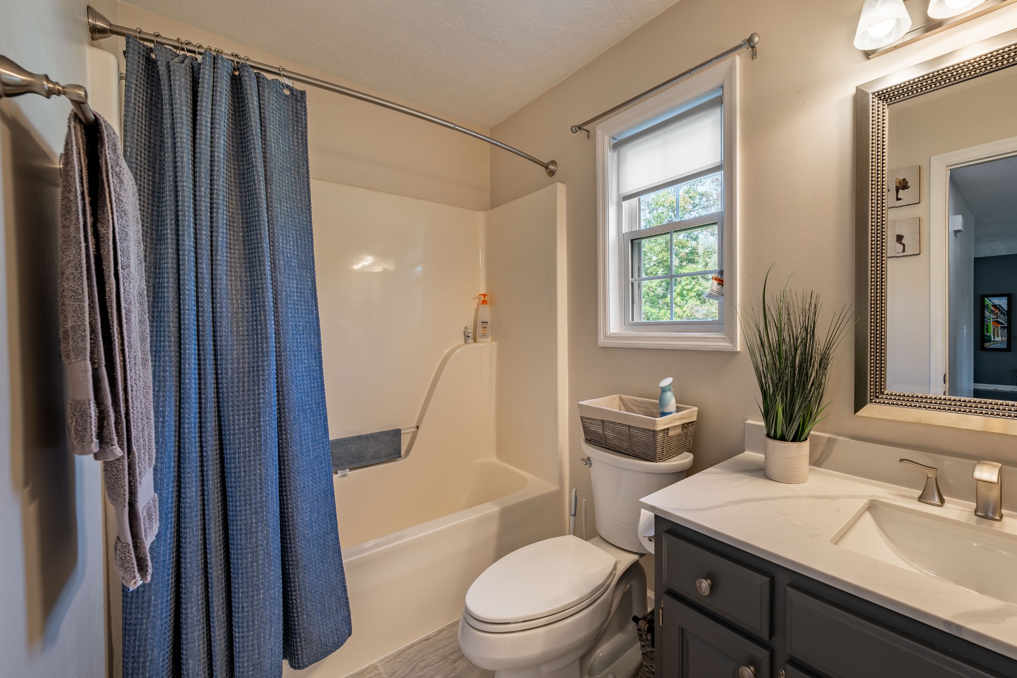 3053 Academy Road Portland, TN 37148 - Photo 42 of 45 a bathroom with a toilet a sink and a bathtub