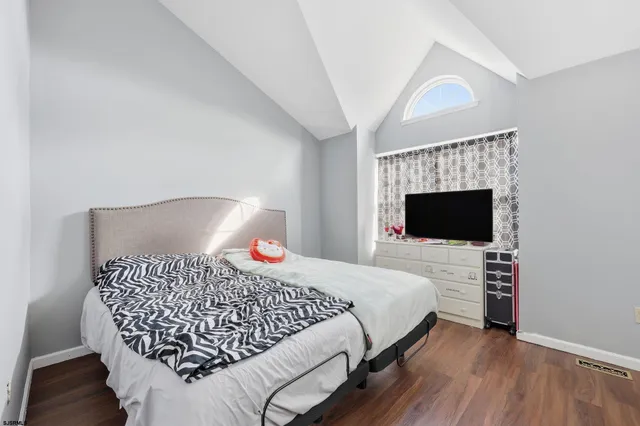 a bedroom with a bed and a fireplace