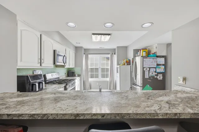a view of a livingroom with furniture and cabinet