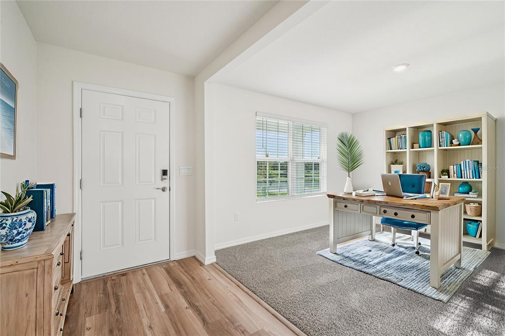 7067 Southeast 113th Place Belleview, FL 34420 - Photo 2 of 11 a work room with furniture and a window
