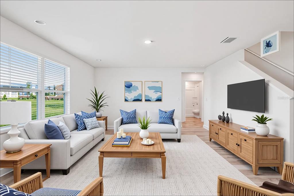 7067 Southeast 113th Place Belleview, FL 34420 - Photo 9 of 11 a living room with furniture and a flat screen tv