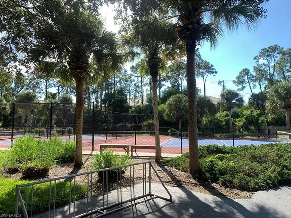 a park view with a tennis court