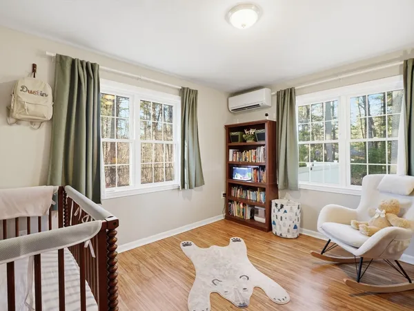 a bedroom with furniture and a window