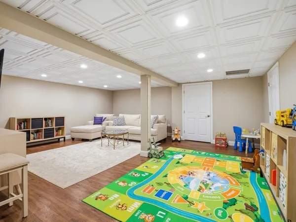 a living room with furniture and a dining table