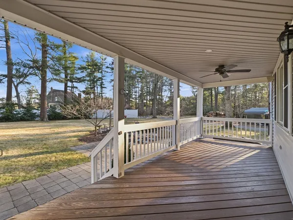 a view of a balcony with wooden floor